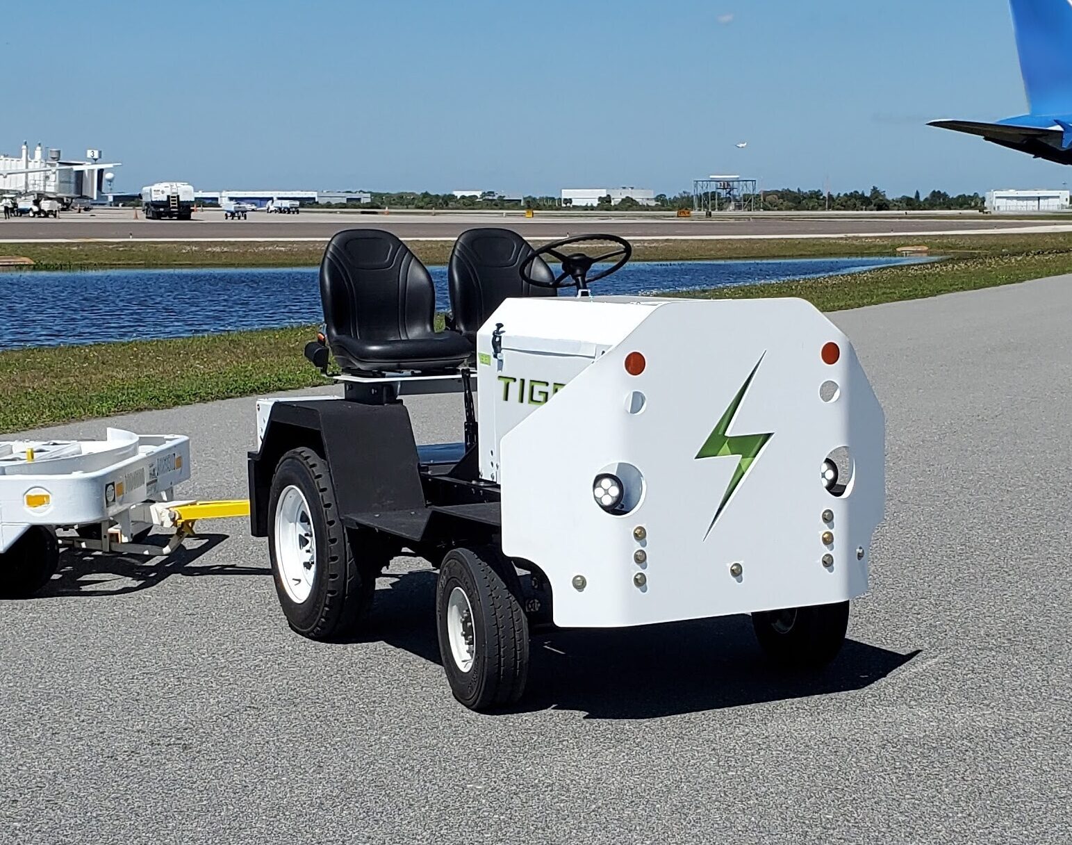 Tiger Li-Ion electric tow tractor and baggage tug on airport tarmac